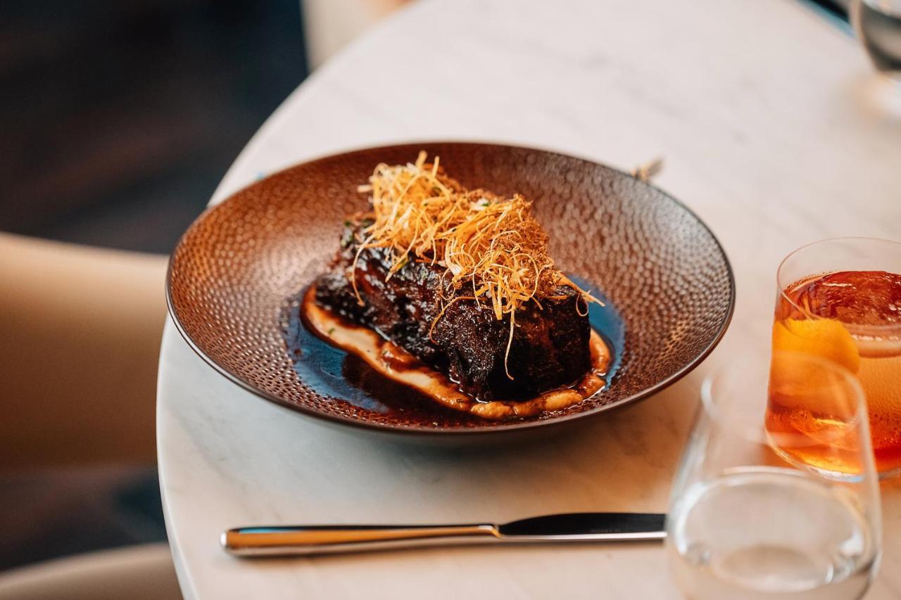 The Dubai Edition Bagian luar foto A dish at the restaurant